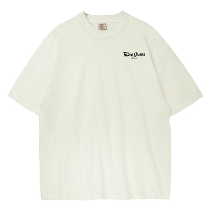 Beige t-shirt with 'Three Olives' logo on a white background